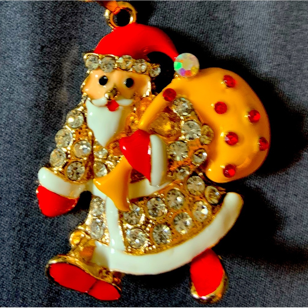 BJ yellow/red Old St Nick with his bag of toys for good children. Length is 12”